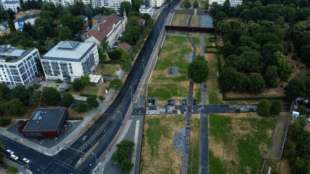 Photo for An aerial view of a highway road with buildings and trees on each side in Berlin, Germany - Royalty Free Image