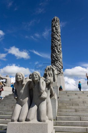 Photo for The Modern sculptures of Vigeland park, Oslo, Norway, vertical, low angle - Royalty Free Image