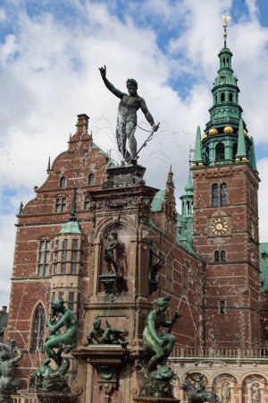 Photo for A vertical of the Neptune Fountain inside the Frederiksborg castle, in Hilerod, Denmark - Royalty Free Image