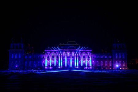 Photo for The illuminated Blenheim Palace with Christmas lights at night in England - Royalty Free Image