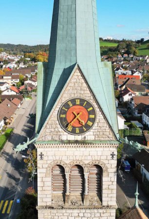 Photo for A beautiful closeup of clock on the St Sebastian church tower building in Wettingen - Royalty Free Image