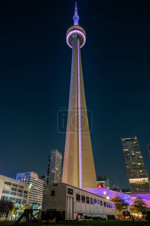 Photo for A vertical shot of a cityscape of Downtown Toronto with CN Tower at night in Ontario, Canada - Royalty Free Image
