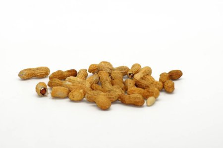 Photo for A closeup of a pile of peanuts isolated on a white background with copy space - Royalty Free Image