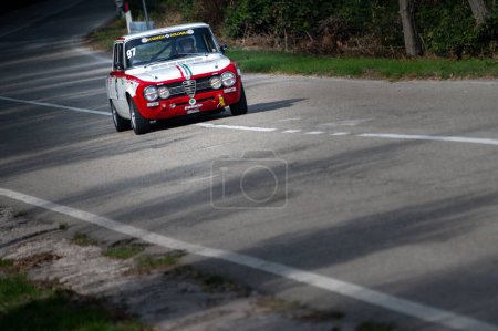 Photo for A red and white car set up during an uphill speed race of the Italian championship in Pesaro - Royalty Free Image