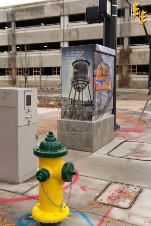 Photo for A fire hydrant and a junction box in Ogden City, Utah - Royalty Free Image