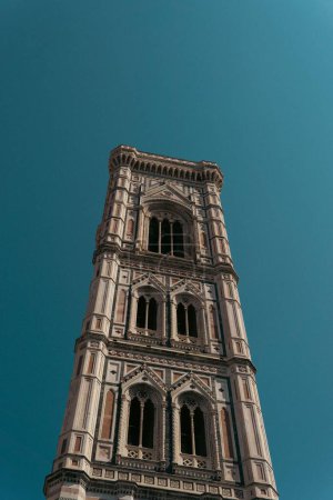 Photo for A vertical shot of Giotto's Bell Tower belonging to the Cathedral of Santa Maria del Fiore in Florence - Royalty Free Image