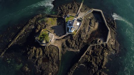 Photo for An aerial top view o Menai Straits Anglesey private island houses in North Wales - Royalty Free Image