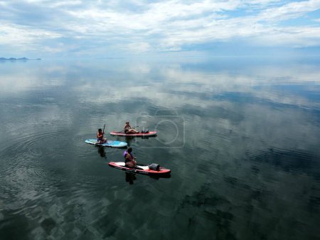 Photo for Three women paddleboarding on the St Laurence - Royalty Free Image