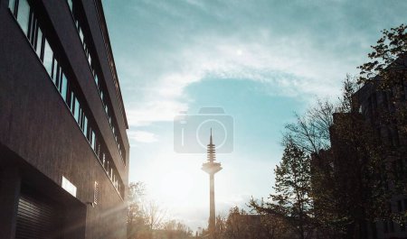 Photo for The silhouette of a television tower against a bright sunrise sky - Royalty Free Image
