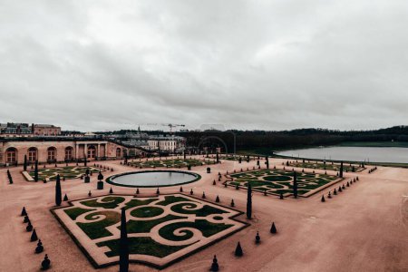 Photo for An iconic Palace of Versailles on a cloudy day in Versailles, France - Royalty Free Image
