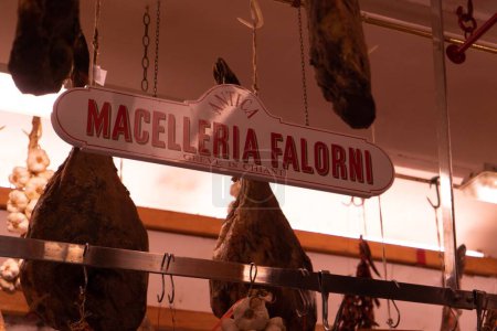 Photo for A closeup shot of a meat market named 'Macelleria Falorni" with meat hanging on the roof - Royalty Free Image