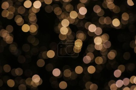 Photo for A background of bokeh lights, a blurred view of glittery yellow lights - Royalty Free Image