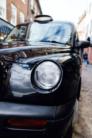 Photo for A vertical shot of a vintage black car details on the street - Royalty Free Image