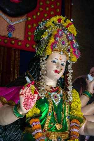 Photo for A vertical shot of the idol of Maa Durga being worshipped at a Mandal in Mumbai, India, for Navratri - Royalty Free Image