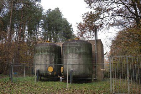 Photo for Two massive water tanks in a forest in Waterloopbos, Marknesse, the Netherlands - Royalty Free Image