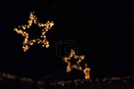 Photo for A Bokeh festival lights at night as decorations for streets - Royalty Free Image