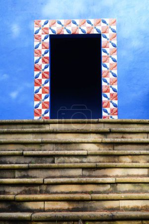 Photo for A closeup of stairs leading inside a blue Portuguese building in Landgraaf - Royalty Free Image