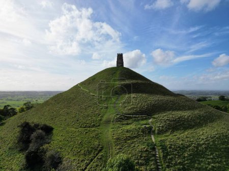 Photo for The Glastonbury Tor hill topped by the roofless St Michael's Tower in Somerset, England. - Royalty Free Image