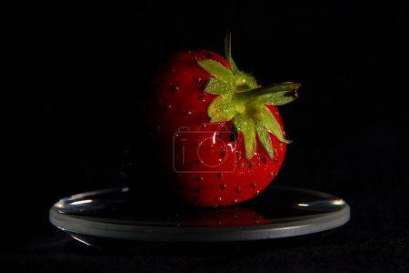 Photo for A closeup of a strawberry on a black background - Royalty Free Image