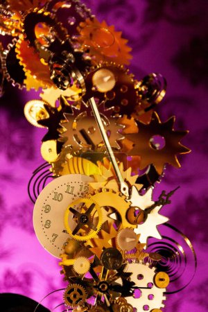 Photo for Antique surreal old clock with cogs and mechanisms, a time travel concept. Peculiar arrangement in a shop window. - Royalty Free Image