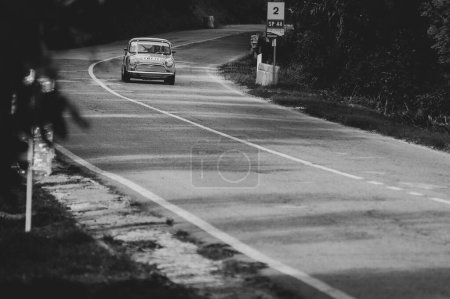 Photo for A greyscale of a car set up during an uphill speed race of the Italian championship in Pesaro - Royalty Free Image