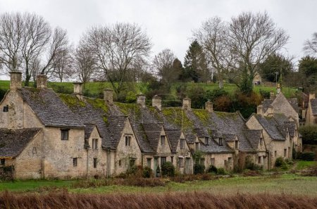 Photo for A row of the historic quintessential Cotswold cottages in Bibury, Gloucestershire, England - Royalty Free Image