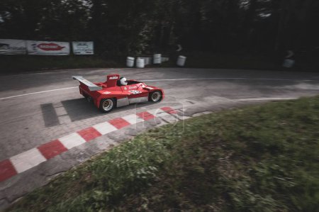 Photo for A red car set up during an uphill speed race of the Italian championship in Pesaro - Royalty Free Image
