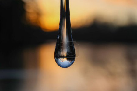 Photo for A soft focus of a water droplet with reflection of the sky - Royalty Free Image