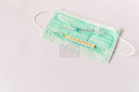 Photo for Thermometer, syringe, Concept of autumn common cold, covid or flu - Royalty Free Image