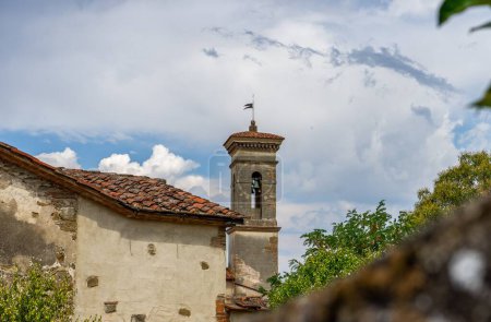Photo for A scenic shot of the bell tower of Giotto House Museum under the clouds and sky in Vicchio - Royalty Free Image
