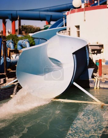 Photo for A vertical view of lonely 1960's waterslide on a sunny day - Royalty Free Image
