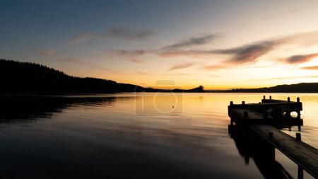 Photo for A beautiful shot of a glowing bright sunset sky over a seashore - Royalty Free Image