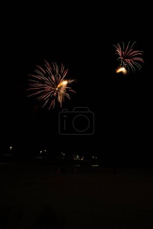 Photo for Fireworks shoot off from Newport Beach pier to kick off boat parade celebration - Royalty Free Image