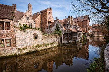 Photo for The traditional medieval houses on a canal in historical Bruges Old Town center, Belgium - Royalty Free Image