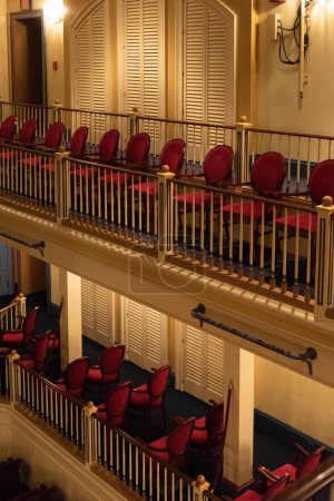Photo for A vertical shot of a theatre with red splitter seats - Royalty Free Image