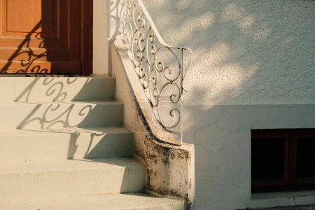 Photo for The outdoor stairs with wrought iron railings in front of the house - Royalty Free Image