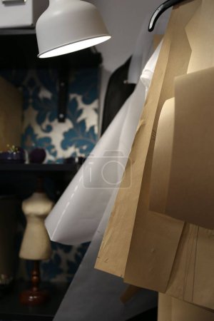 Photo for A vertical shot of fabric material for making dresses in a room - Royalty Free Image