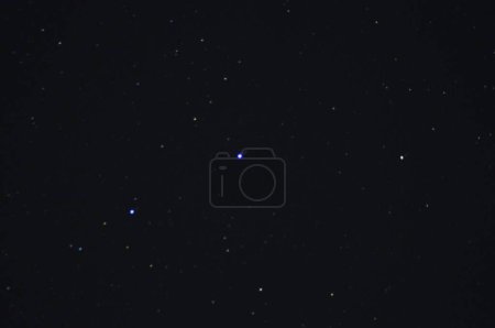 Photo for A scenic view of a stars in the dark sky during nighttime - Royalty Free Image