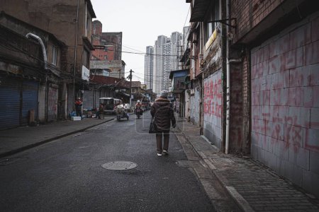 Photo for A Local Street in Huang Pu District (Shanghai, China) with people walking - Royalty Free Image