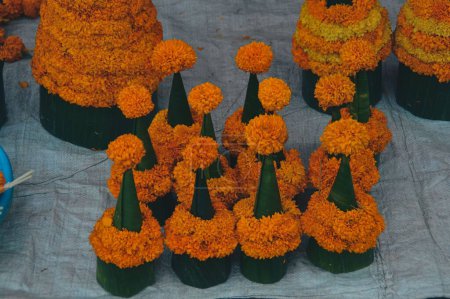 Photo for Ton dauk dao heuang or marigold flower trees shaped as stupa or jedi, Buddhist devotional offerings in Luang Prabang, Laos - Royalty Free Image