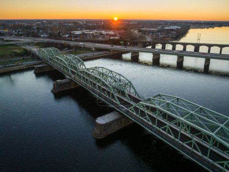 Photo for An aerial of the Lower Trenton highway bridge over the Delaware river in Trenton, New Jersey at sunrise - Royalty Free Image