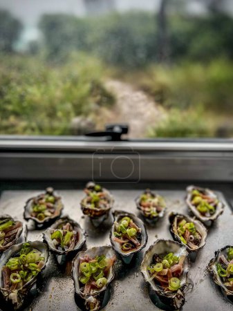Photo for A beautiful view of Oysters Kilpatrick in the plate - Royalty Free Image