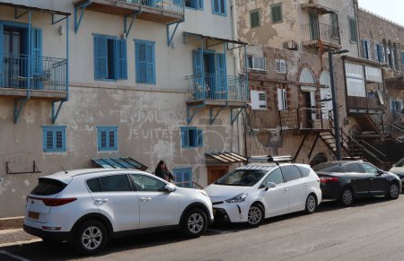 Photo for A typical old house in the Old City of Acre with cars parked in the yard, Israel - Royalty Free Image