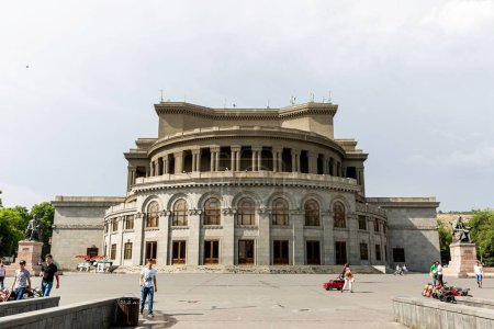 Photo for An Armenian National Opera and Ballet Theatre surrounded by green grass and trees - Royalty Free Image