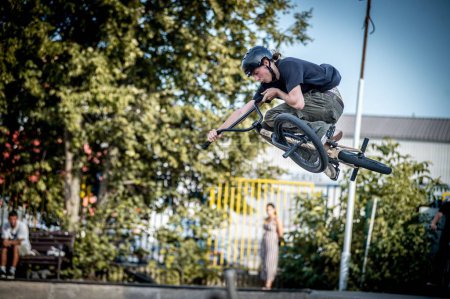 Photo for A young man jumping on a bike during the BMX race event in Skate park in Kosice - Royalty Free Image