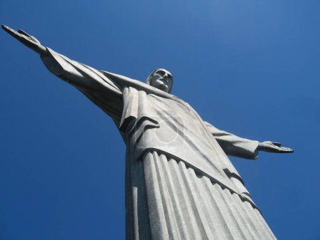 Photo for A low-angle shot of the famous Christ the Redeemer statue in Rio against the clear blue sky - Royalty Free Image