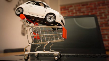 Photo for A miniature shopping cart and a car - Royalty Free Image
