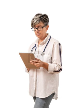 Photo for A female doctor with a stethoscope holding  a tablet - Royalty Free Image