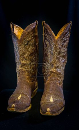 Photo for A vertical shot of boots on an isolated background - Royalty Free Image