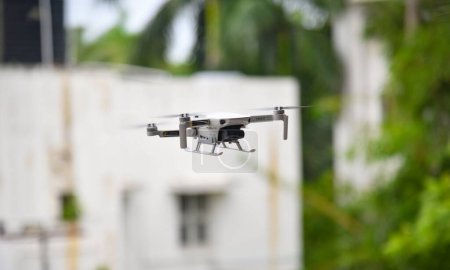 Photo for A closeup shot of a DJI Mavic Mini 2 drone on the blurry background - Royalty Free Image